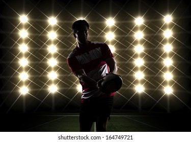 Silhouette os a Rugby player in a red uniform. White Background - Powered by Shutterstock