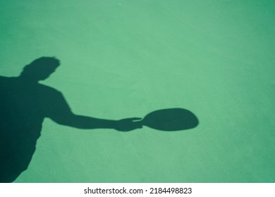 Silhouette Outline Of A Man Playing Pickleball.       