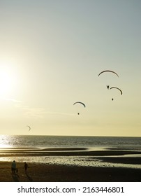 Silhouette Of Para Gliding At Sunset Sky With Sea Background