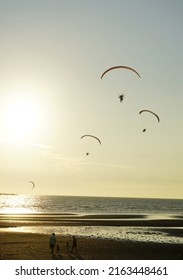 Silhouette Of Para Gliding At Sunset Sky With Sea Background