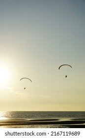 Silhouette Of Para Gliding At Sunset Sky With Sea Background