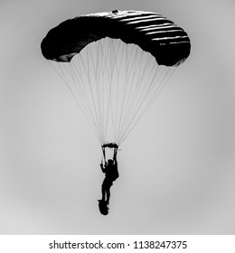 Silhouette of a paratrooper with equipment during an excercise.