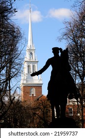 Silhouette of Paul Revere statue against the tower of Old North Church in Boston, Massachusetts