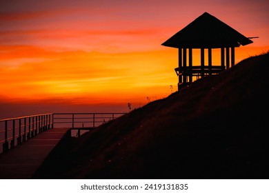 Silhouette pavilion by the hill during sunset on the mountain peak of Doi Pui Co mountain in Mae Hong Son province Thailand. Beautiful scenic landscape, Hiking trails and camping in Northern Thailand - Powered by Shutterstock