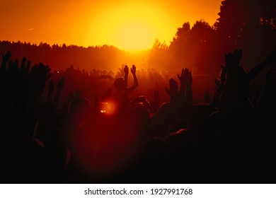 Silhouette of people on a big festival event