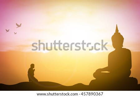 Silhouette people pray from buddha statue to hope for help on sun set and bokeh background. Inspiration from help to hope for Vesak Day or Wesak, Jayanti day or Visakha Bucha day