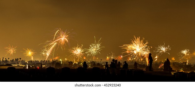 Silhouette Of People Watching Fireworks On The Rooftop Of A Building In LA, CA, USA, On USA's Independence Day, July 4th, 2016