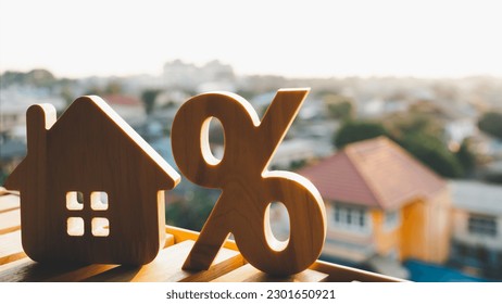 Silhouette of Percentage and house sign symbol icon wooden on wood table. Concepts of home interest, real estate, investing in inflation. - Shutterstock ID 2301650921