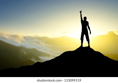 Silhouette Of The Person On The Peak Of Mountain. Sport And Active Life