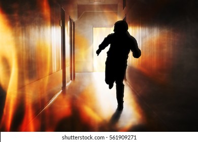 Silhouette Of Person Running Out Of Fire Escape On Corridor Of Building