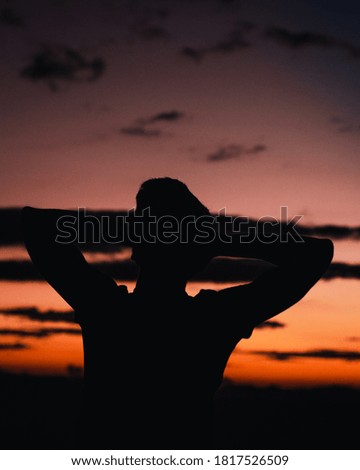 A girl from the 2019 Queensland National Team watches the sunset in Adelaide.