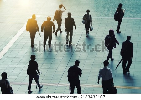 Silhouette of a person walking in the city