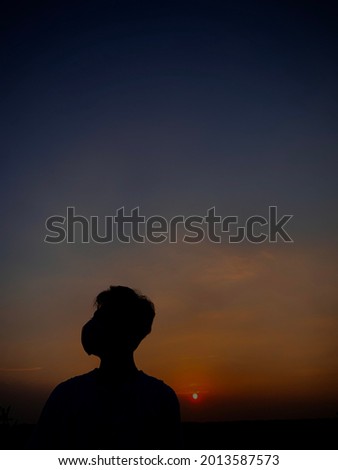 Similar – A girl from the 2019 Queensland National Team watches the sunset in Adelaide.