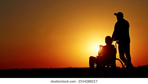 Silhouette of a person in a wheelchair being pushed by another person at sunset. - Powered by Shutterstock