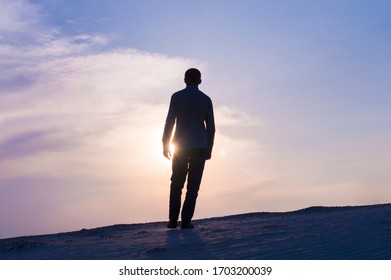 Silhouette Photo Of Guy At Sunset Time On Sky Background