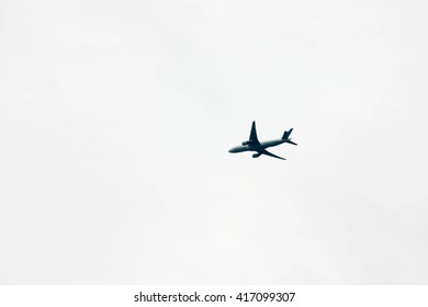 Silhouette of plane in cloudless sky
