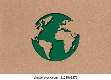The silhouette of the planet in the style of paper clippings. Ecological concept. Green planet. Earth Day. Mother Nature. Recycling. Biodegradable material. Craft - Shutterstock ID 2111861273