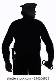 Silhouette Of Police Officer With Handcuffs In Hand