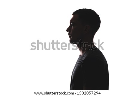 Silhouette portrait of young European man in profile isolated white background