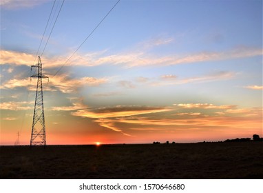 Silhouette Of Power Lines At Sunrise In Australia