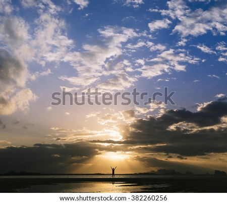 Silhouette prayer man happy hands rise to praise god on beach background. France christian love bible vision in. Islam open arms worship goddess in sun light concept.  Good life positive thinking.