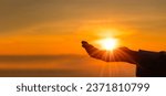 Silhouette of prayer woman worship God in the morning with sunrise sky background. Person hands open palm up worship. God helping repent catholic easter lent mind pray. Christian religion concept.