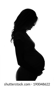 a  silhouette of a pregnant woman on a white background 