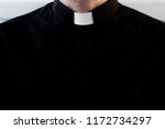 Silhouette of a priest without a face