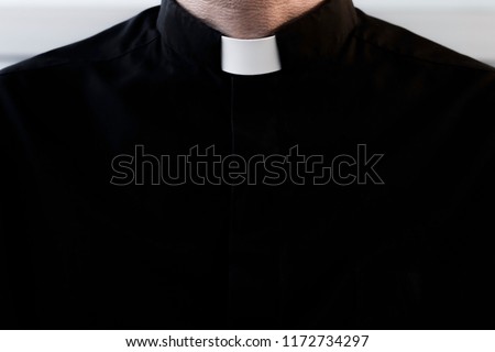 Silhouette of a priest without a face
