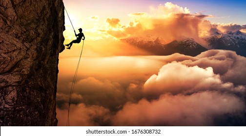 Скалолазание силуэта со скалы. Прекрасный вид с воздуха на горы во время красочного и яркого заката или восхода солнца. Пейзаж, сделанный в Британской Колумбии, Канада. композит. Концепция: приключение
