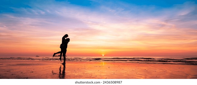 Silhouette of romantic couple kissing at sunset on a serene beach, enjoying a dreamy vacation in warm tropical holiday destination. Love, romance, honeymoon, Valentine's day. - Powered by Shutterstock