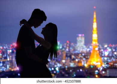 Silhouette Of Romantic Lovers With Tokyo Tower In Japan With Sunset