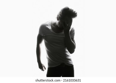 Silhouette Of Sad Boy. Black And White Portrait Of Emotion Young Man