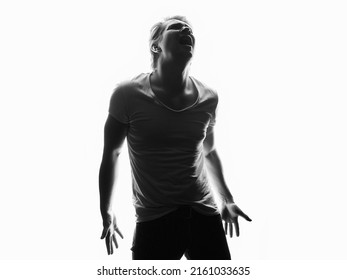 Silhouette Of Sad Boy. Black And White Portrait Of Screaming Young Man