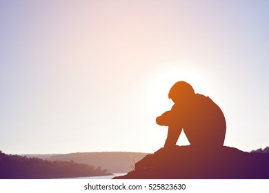 Silhouette Of Sad Boy And Sitting On The Rock In River At The Sky Sunset, Vintage Tone