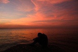 Sad men viewing sunset, a Person Photo by Gabyvieira