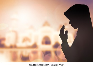 Silhouette sad muslim woman prayer wear hijab fasting pray to allah on mosque arabesque background concept abstract islamic pakistan girl hands on peace and humility, arabic calendar in eid mubarak.
