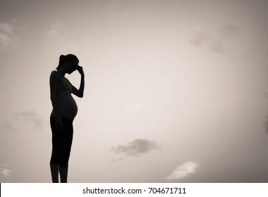 Silhouette Of Sad Pregnant Woman. Pregnancy Difficulties Concept. 