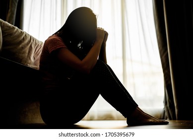 Silhouette Sad Scared And Worried Woman Sitting In Dark Bedroom , Stay At Home Quarantine Coronavirus Pandemic Prevention