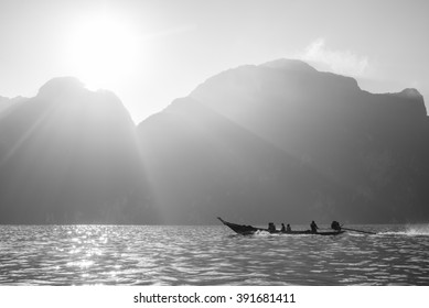 Silhouette Sailing Boat With Silver Lining In Background