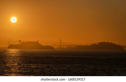 Silhouette Of The San Francisco Bay With Alcatraz Island , Bay Bridge And Treasure Island On A Early Morning Sunrise