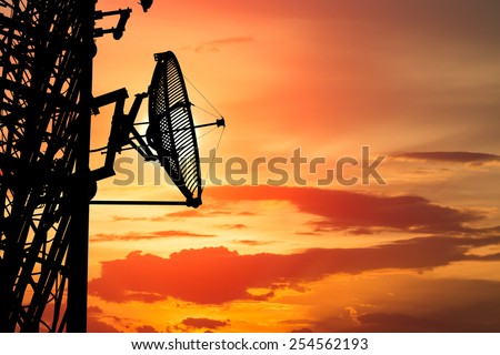 silhouette satellite communication tower poles on sunset