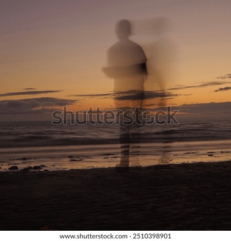 Similar – a woman looks at the sea. rear view, blurred