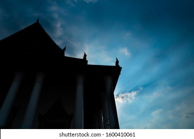 Silhouette scene of Buddhist temple before sunset, Thailand.