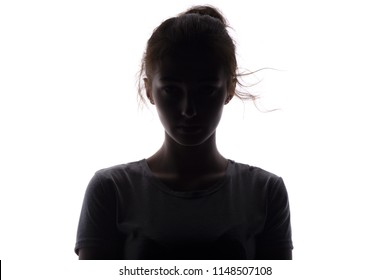 silhouette of a serious and confident young woman looking straight, beautiful girl on a white isolated background, concept beauty and fashion