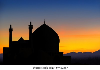 Silhouette of Shah mosque view from Ali Qapu palace in Isfahan at sunset, Iran
