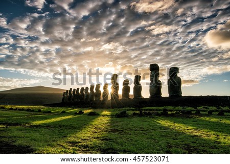 Silhouette shot of Moai statues in Easter Island, Chile sunrise