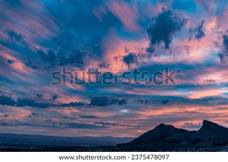 Silhouette of Sierra Elvira (Atarfe, Spain) in a beautiful cloudy sunset