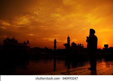 Silhouette Of Sikh Prayer At Golden Temple, Amritsar, India