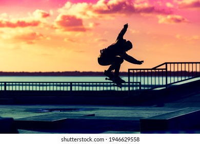 silhouette of skater at skate park